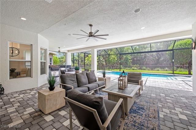 28617 Sicily Loop, Bonita Springs, FL 34135 - view of patio / terrace with an outdoor living space, an outdoor pool, a ceiling fan, and a lanai