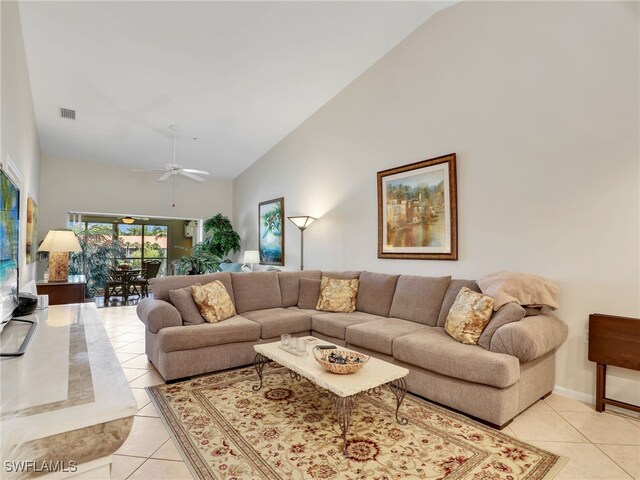 6790 Beach Resort Dr Unit 14, Naples, FL 34114 - living room with high vaulted ceiling, light tile patterned floors, and ceiling fan