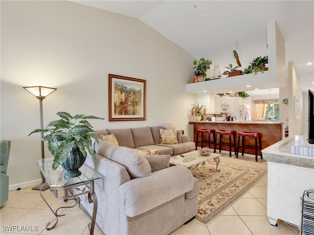 6790 Beach Resort Dr Unit 14, Naples, FL 34114 - living area featuring light tile patterned flooring and high vaulted ceiling