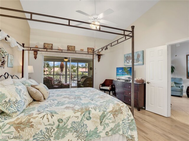 6790 Beach Resort Dr Unit 14, Naples, FL 34114 - bedroom featuring access to outside, a towering ceiling, and wood finished floors