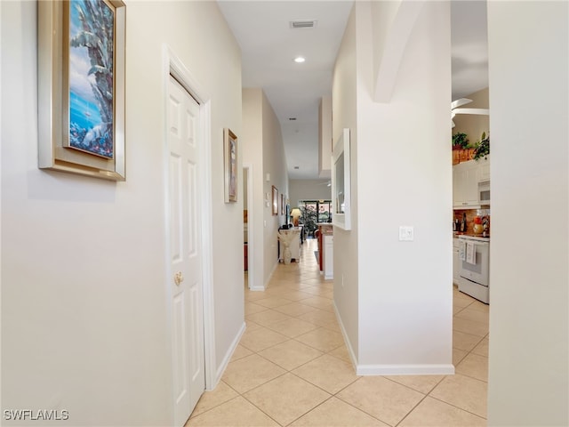 6790 Beach Resort Dr Unit 14, Naples, FL 34114 - hall with light tile patterned flooring and recessed lighting