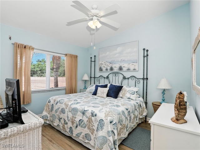 6790 Beach Resort Dr Unit 14, Naples, FL 34114 - bedroom featuring wood finished floors, vaulted ceiling, and ceiling fan