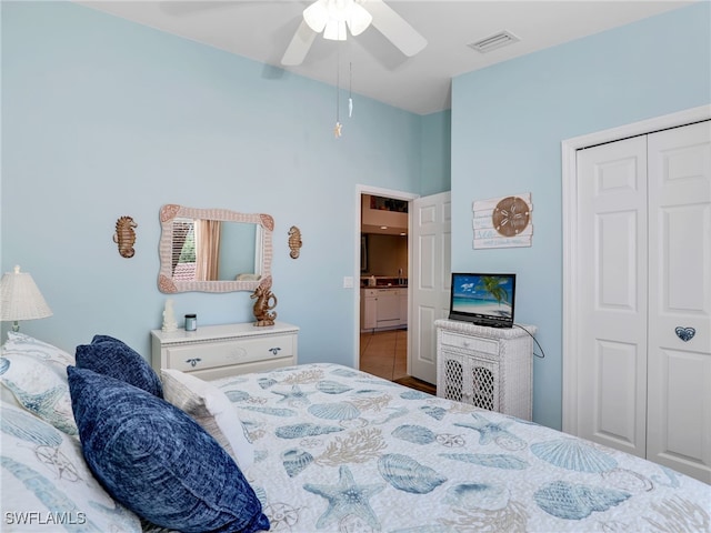 6790 Beach Resort Dr Unit 14, Naples, FL 34114 - bedroom with a closet, a ceiling fan, and tile patterned flooring