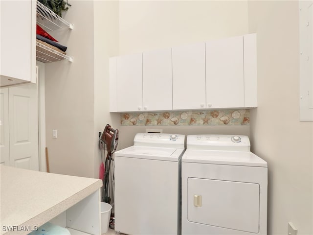 6790 Beach Resort Dr Unit 14, Naples, FL 34114 - laundry room featuring cabinet space and washer and clothes dryer