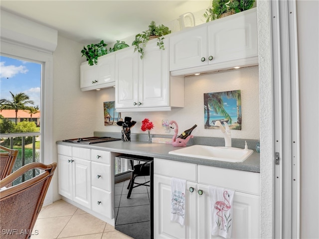6790 Beach Resort Dr Unit 14, Naples, FL 34114 - kitchen featuring light tile patterned floors, white cabinets, and black dishwasher