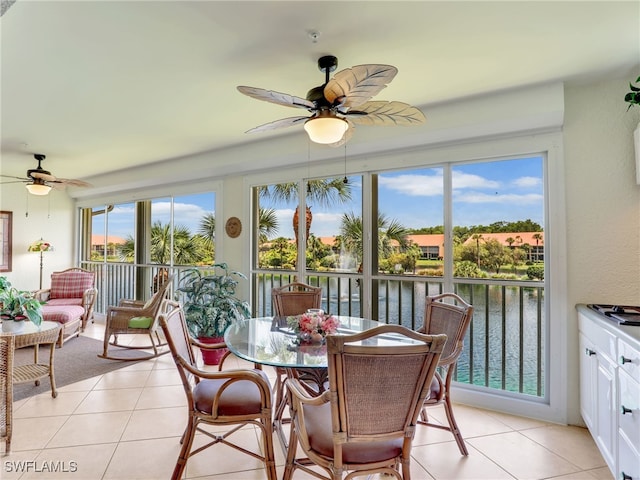 6790 Beach Resort Dr Unit 14, Naples, FL 34114 - sunroom featuring a water view and tile patterned floors