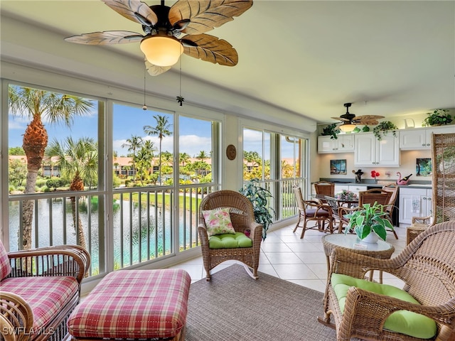 6790 Beach Resort Dr Unit 14, Naples, FL 34114 - sunroom featuring tile patterned flooring and a water view