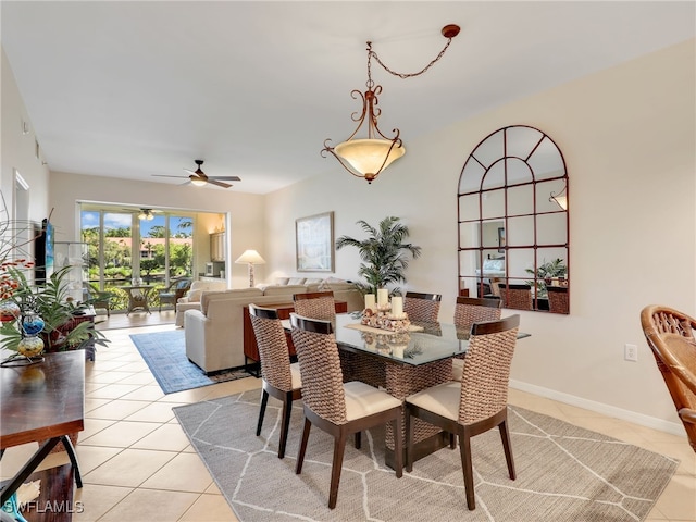 6790 Beach Resort Dr Unit 13, Naples, FL 34114 - dining space with light tile patterned flooring and ceiling fan
