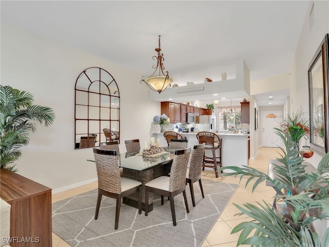 6790 Beach Resort Dr Unit 13, Naples, FL 34114 - dining space featuring light tile patterned floors