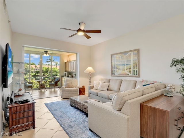 6790 Beach Resort Dr Unit 13, Naples, FL 34114 - living room featuring a ceiling fan and light tile patterned floors