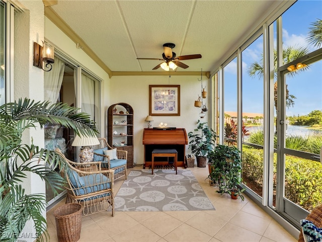 6790 Beach Resort Dr Unit 13, Naples, FL 34114 - sunroom / solarium featuring tile patterned flooring, a textured ceiling, and a water view