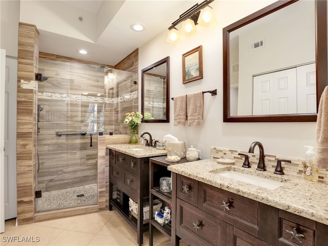 6790 Beach Resort Dr Unit 13, Naples, FL 34114 - bathroom with a stall shower, two vanities, tile patterned floors, and recessed lighting