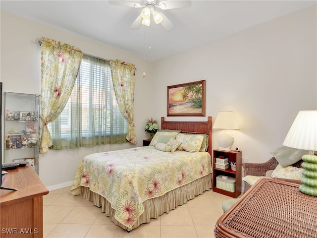 6790 Beach Resort Dr Unit 13, Naples, FL 34114 - bedroom featuring light tile patterned floors and ceiling fan
