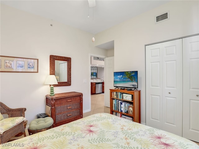 6790 Beach Resort Dr Unit 13, Naples, FL 34114 - bedroom featuring a closet and light tile patterned floors