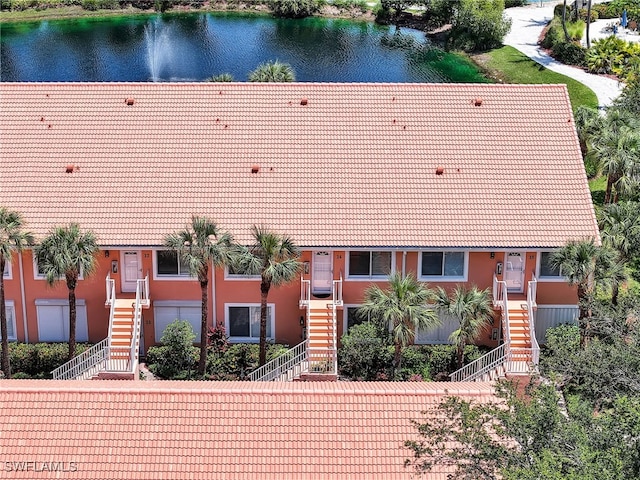 6790 Beach Resort Dr Unit 13, Naples, FL 34114 - view of front of property featuring stairway, a tiled roof, and stucco siding