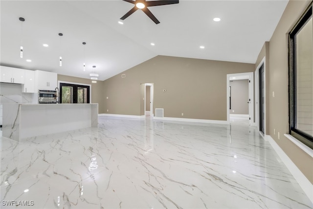 431 1st St NW, Naples, FL 34120 - unfurnished living room featuring light marble finish floors, a ceiling fan, vaulted ceiling, recessed lighting, and french doors