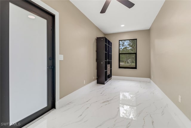 431 1st St NW, Naples, FL 34120 - spare room featuring ceiling fan, marble tiled floors, and recessed lighting