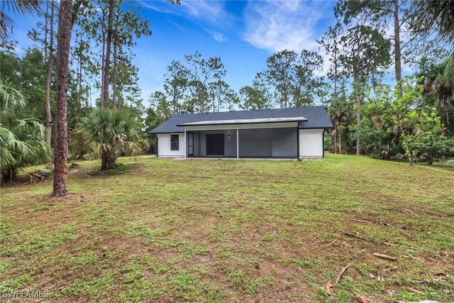 431 1st St NW, Naples, FL 34120 - back of property featuring a lawn