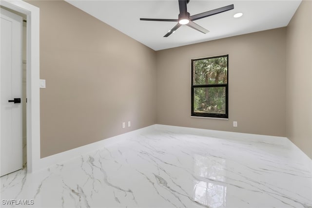 431 1st St NW, Naples, FL 34120 - unfurnished room featuring marble look tile flooring, a ceiling fan, and recessed lighting