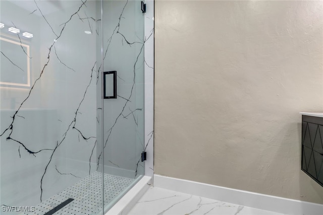 431 1st St NW, Naples, FL 34120 - bathroom featuring a marble finish shower and baseboards