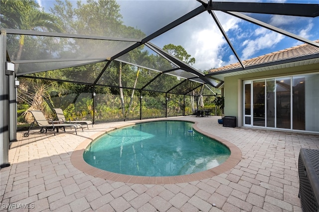 12977 Turtle Cove Trl, North Fort Myers, FL 33903 - swimming pool featuring a patio area and glass enclosure