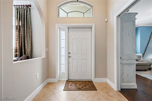 12977 Turtle Cove Trl, North Fort Myers, FL 33903 - foyer entrance featuring arched walkways and tile patterned flooring