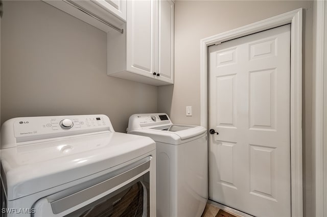 12977 Turtle Cove Trl, North Fort Myers, FL 33903 - washroom featuring washing machine and clothes dryer and cabinet space