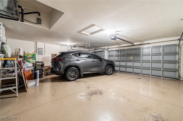 12977 Turtle Cove Trl, North Fort Myers, FL 33903 - garage featuring a garage door opener and electric panel