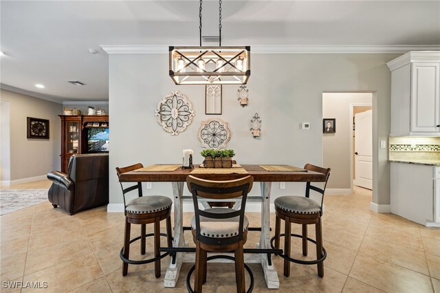 12977 Turtle Cove Trl, North Fort Myers, FL 33903 - dining space featuring ornamental molding, light tile patterned floors, and recessed lighting