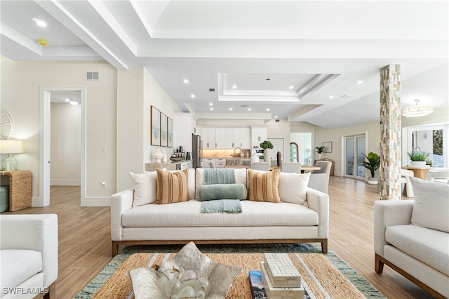 5203 Starfish Ave, Naples, FL 34103 - living area with a raised ceiling, recessed lighting, and light wood-style floors