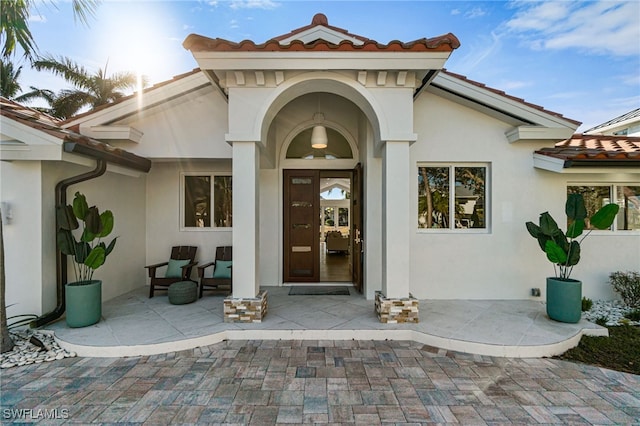 5203 Starfish Ave, Naples, FL 34103 - entrance to property featuring stucco siding and a tile roof
