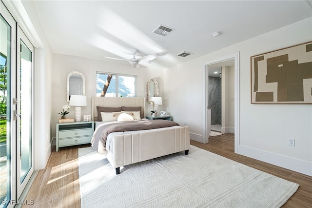 5203 Starfish Ave, Naples, FL 34103 - bedroom with wood finished floors and a ceiling fan