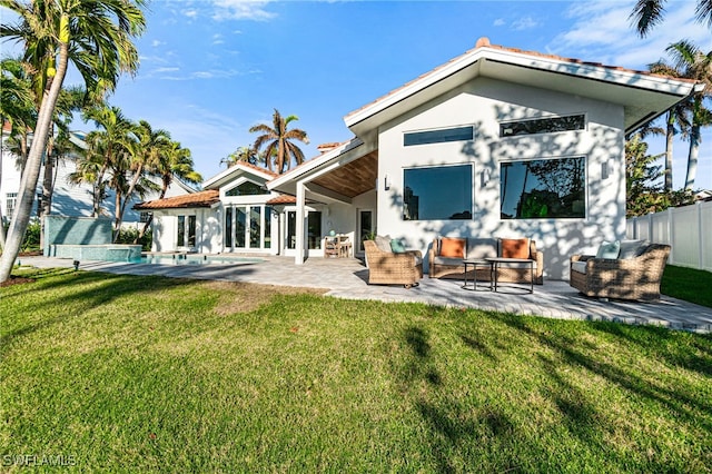 5203 Starfish Ave, Naples, FL 34103 - back of house with outdoor lounge area, stucco siding, and a patio area