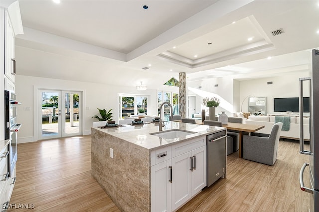 5203 Starfish Ave, Naples, FL 34103 - kitchen featuring open floor plan, stainless steel dishwasher, a raised ceiling, plenty of natural light, and recessed lighting