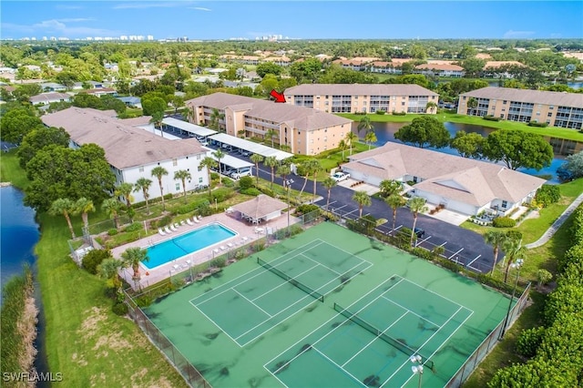 9650 Victoria Ln Unit 201B, Naples, FL 34109 - drone / aerial view of a pool area and a large body of water