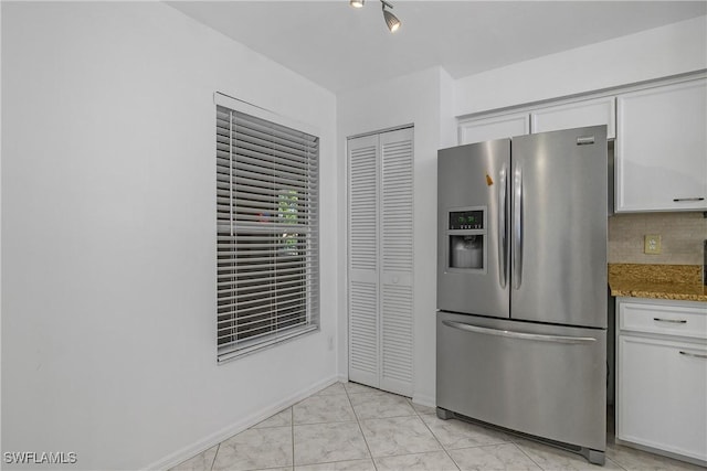 9650 Victoria Ln Unit 201B, Naples, FL 34109 - kitchen with stainless steel refrigerator with ice dispenser, stone counters, white cabinets, light marble finish floors, and tasteful backsplash
