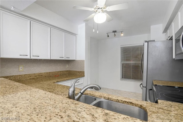 9650 Victoria Ln Unit 201B, Naples, FL 34109 - kitchen featuring tasteful backsplash, white cabinetry, range with electric stovetop, and ceiling fan