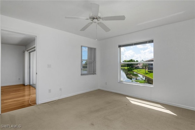 9650 Victoria Ln Unit 201B, Naples, FL 34109 - carpeted empty room with baseboards and ceiling fan