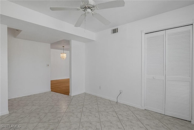 9650 Victoria Ln Unit 201B, Naples, FL 34109 - unfurnished room featuring ceiling fan and a chandelier