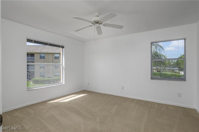9650 Victoria Ln Unit 201B, Naples, FL 34109 - carpeted empty room featuring healthy amount of natural light and ceiling fan