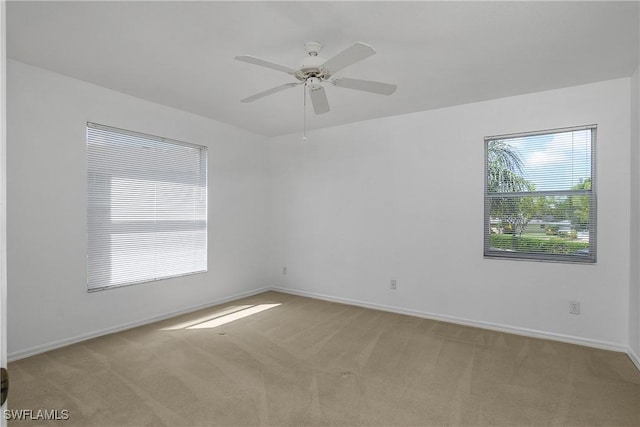 9650 Victoria Ln Unit 201B, Naples, FL 34109 - carpeted spare room featuring a ceiling fan and baseboards