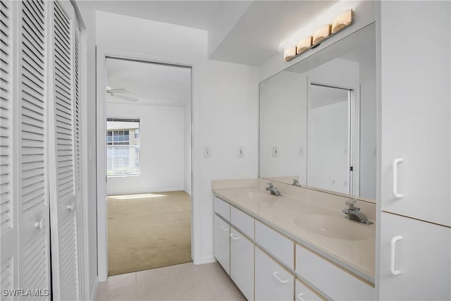 9650 Victoria Ln Unit 201B, Naples, FL 34109 - full bath featuring a closet, double vanity, tile patterned floors, and a ceiling fan