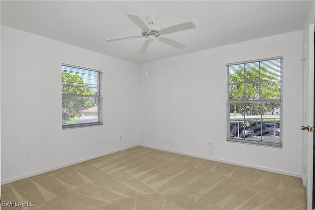 9650 Victoria Ln Unit 201B, Naples, FL 34109 - unfurnished room with light carpet and a ceiling fan
