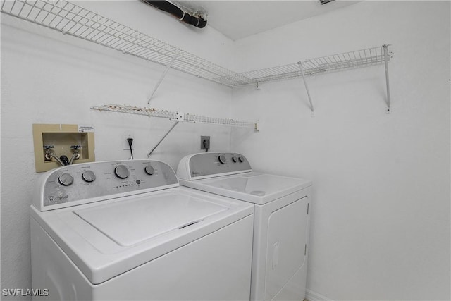 9650 Victoria Ln Unit 201B, Naples, FL 34109 - washroom featuring washing machine and clothes dryer
