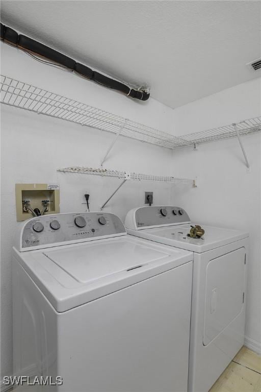 9650 Victoria Ln Unit 201B, Naples, FL 34109 - laundry area with washing machine and clothes dryer