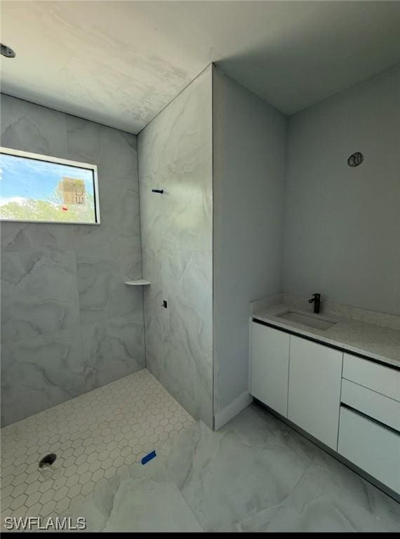 3722 29th Ave NE, Naples, FL 34120 - full bath with vanity, a marble finish shower, and marble look tiles