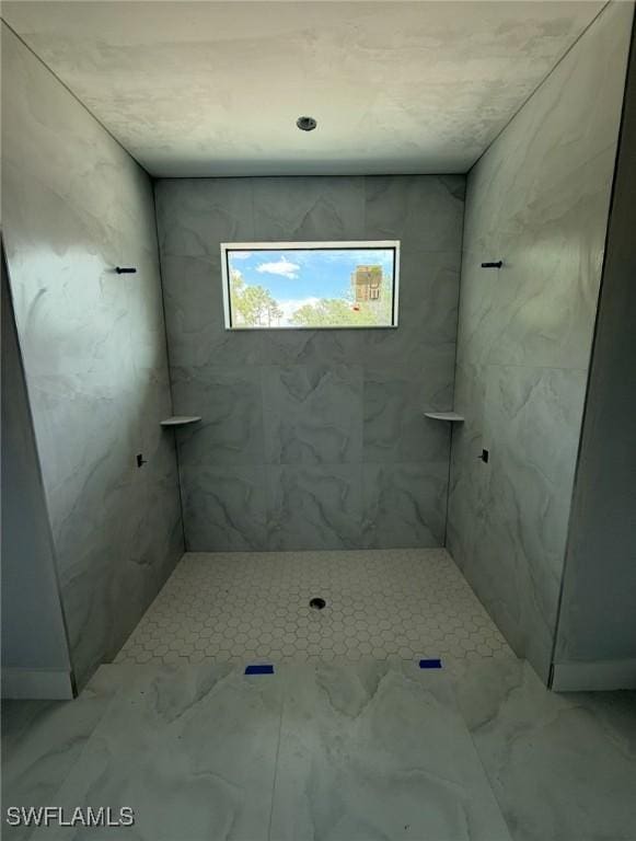 3722 29th Ave NE, Naples, FL 34120 - full bath featuring marble look tiles and a tile shower