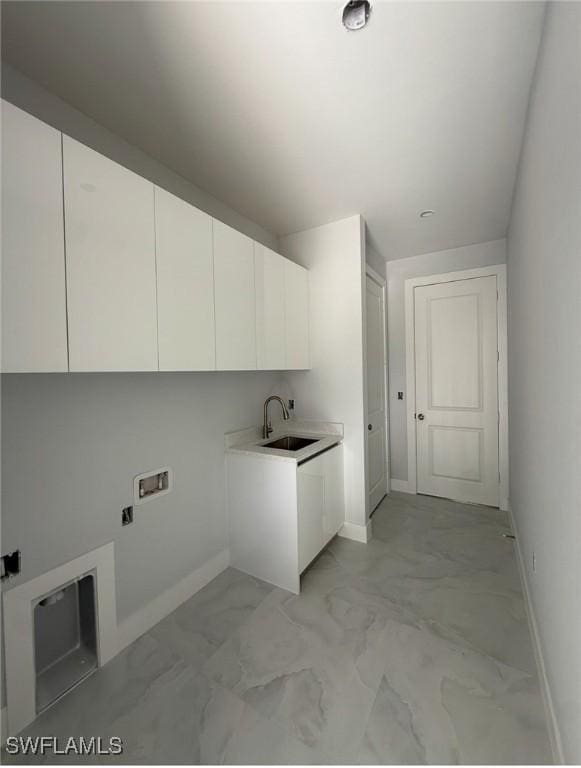 3722 29th Ave NE, Naples, FL 34120 - laundry room with cabinet space, light marble finish floors, and washer hookup