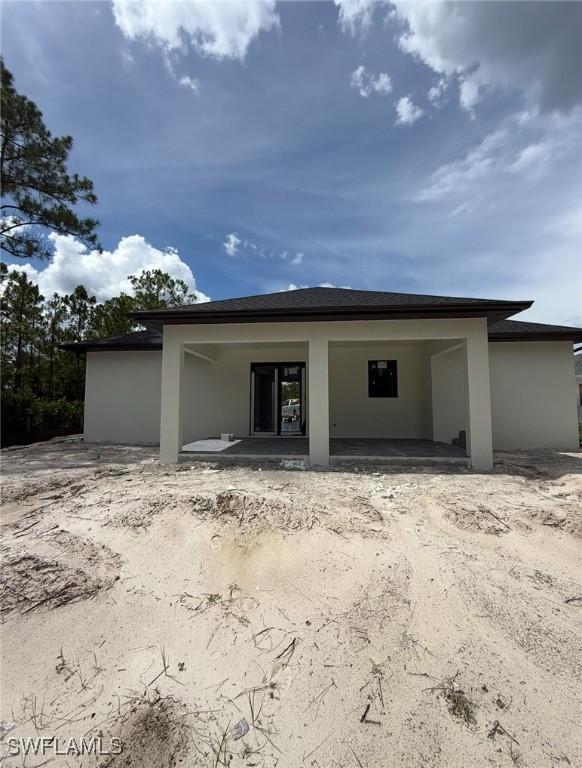 3722 29th Ave NE, Naples, FL 34120 - rear view of house with stucco siding