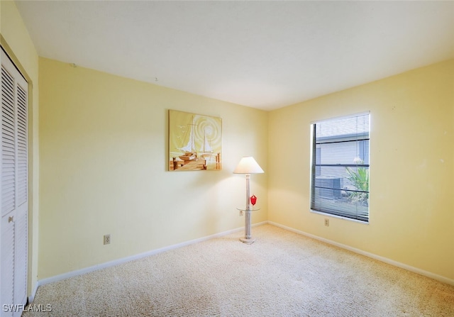 113 Picardy Ct, Naples, FL 34112 - unfurnished bedroom featuring carpet and a closet